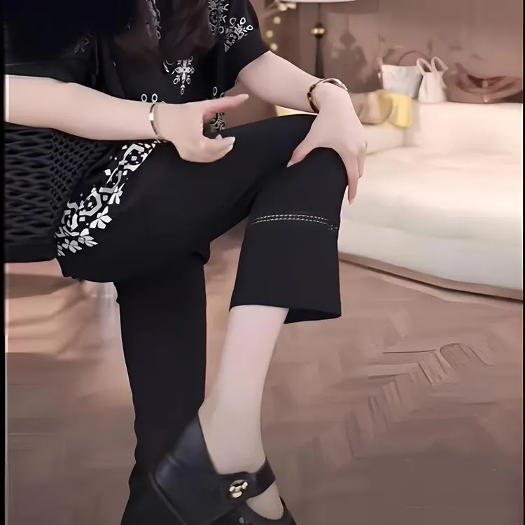 夏季新款轻薄欧货黑色蕾丝镂空拼接高弹八分休闲裤女