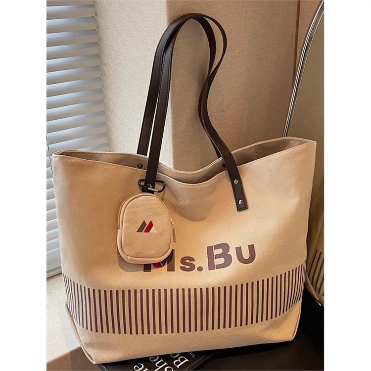 大容量单肩包包女秋冬短途旅行手提帆布袋小众百搭上课通勤托特包