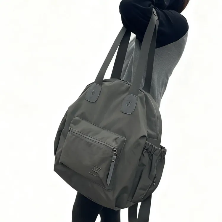 新款时尚潮流波纹防水面料中性耐磨男女通用单肩手提双肩包