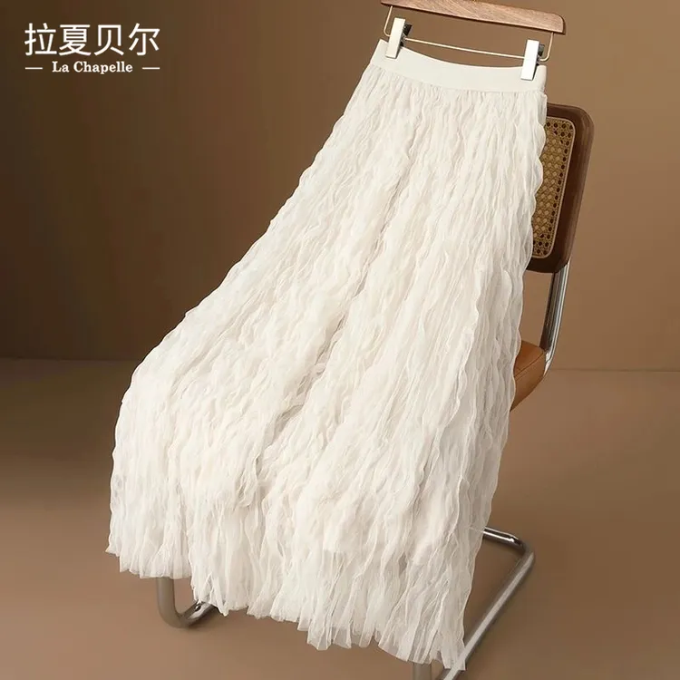 拉夏贝尔高级感杏色褶皱半身裙女春2025显瘦中长款a字大摆纱裙