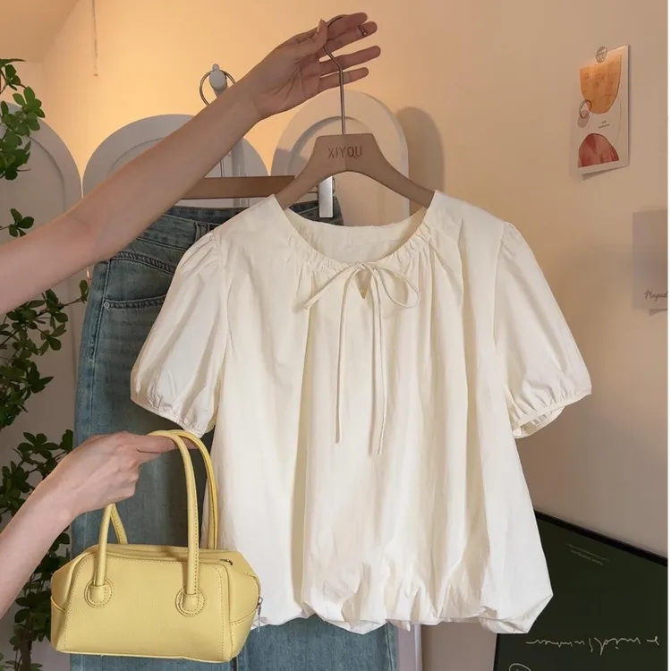 2025夏季新款韩系可爱减龄圆领绑带泡泡袖花苞下摆宽松杏色衬衫女