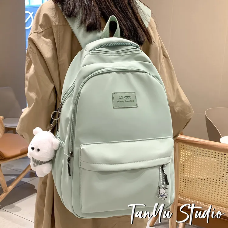 探屿新款书包初中女生纯色简约大容量高中生双肩包女小学生背包男