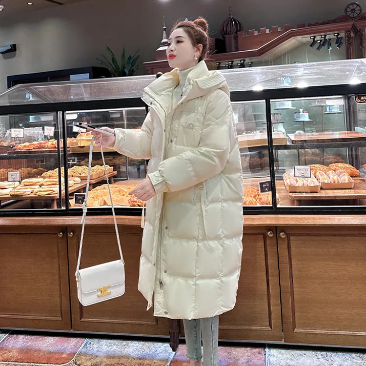 纪诗哲冬季米白色羽绒服女中长款2025新款连帽时尚白鸭绒保暖外套