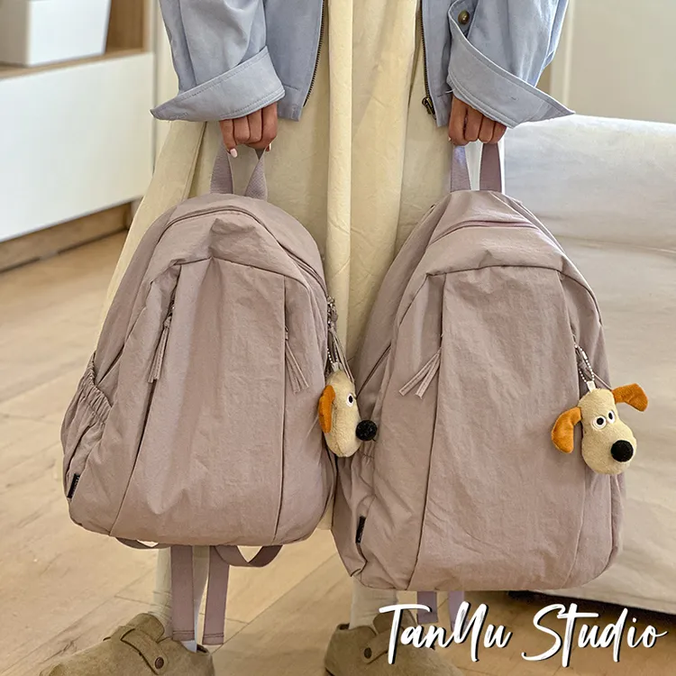 探屿旅游轻便高级感小众双肩包大学生通勤初中生女生书包简约背包