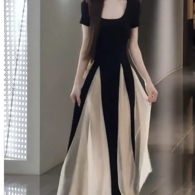 设计感拼网纱假两件连衣裙女2025春夏新款时尚气质收腰度假长裙子
