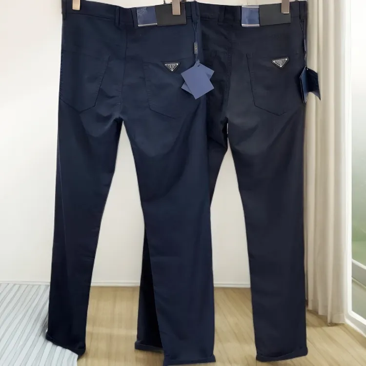 春季新款三角标徽章牛仔裤男士潮牌韩版百搭直筒休闲修身黑色长裤