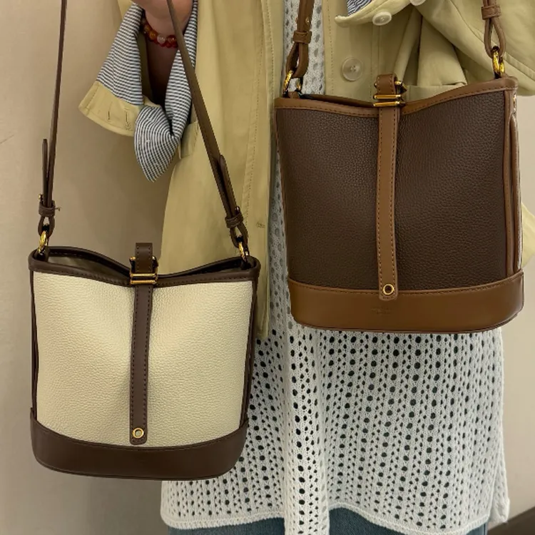 【精品推荐】设计师款时尚百搭双拼色轻奢饺子包包女款斜挎枕头包