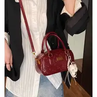 压花洋气防刮气质波士顿学院风圆筒款双根斜挎包