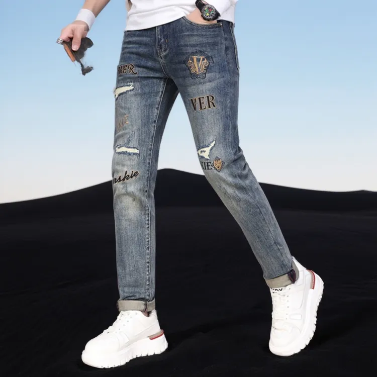 巴赛娜缇破洞牛仔裤男款星星印花修身小脚泼墨时尚休闲百搭长裤子