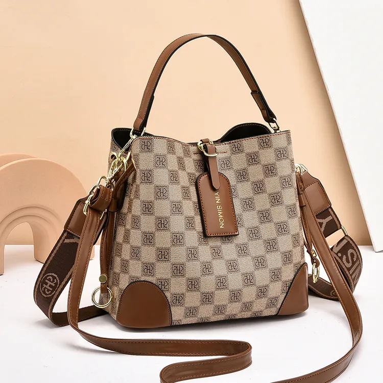 YIN.SIMON/茵熙曼流行水桶包2023新款洋气小众女士手提单肩斜挎包