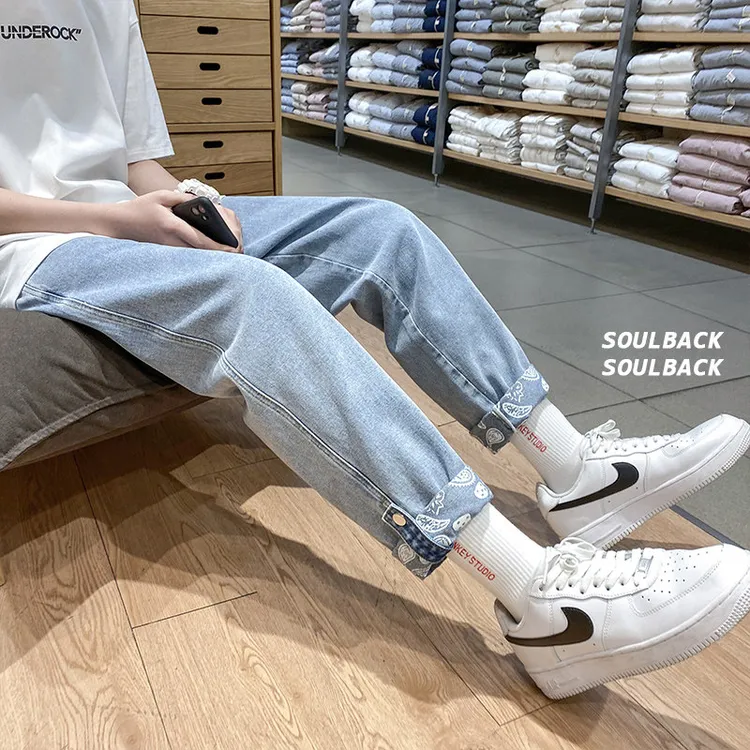 水洗牛仔裤男款夏季宽松直筒裤翻边带扣腰果花休闲裤子潮牌九分裤