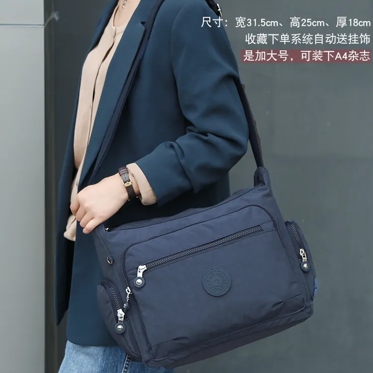 新款简约加大多隔层斜挎包女轻便防水帆布包男旅行大容量单肩潮包