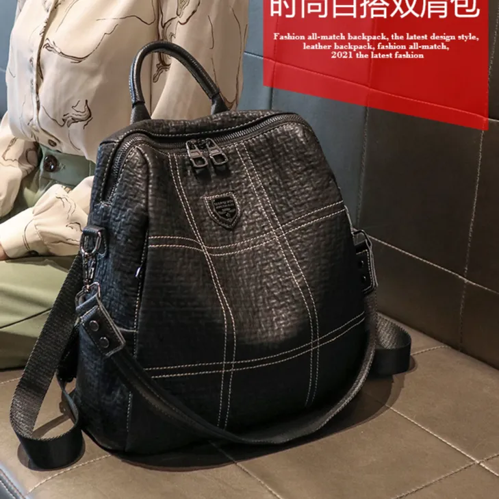  双肩包女2025新款时尚防盗真皮软皮黑色背包