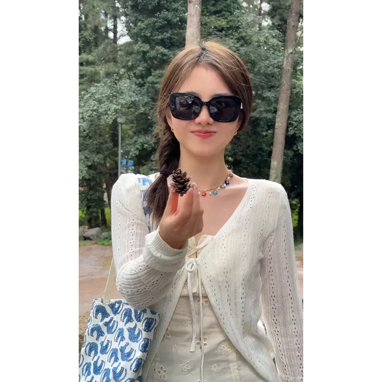 白色镂空系带设计感纯欲长袖针织开衫女早秋显瘦气质秋装披肩外套