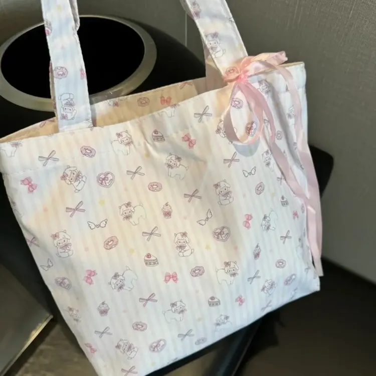 韩系大容量碎花帆布托特包2025新款小羊卡通通勤单肩包小众手提包