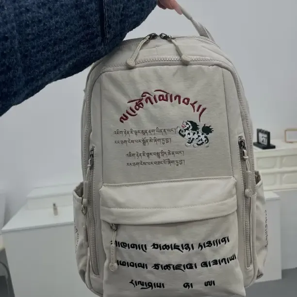 浪挫棉巴休闲风男女通用大学生潮流时尚百搭初中双肩包女高中生浪