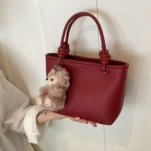 红色手提水桶包女2025新款潮秋冬百搭斜挎包高级感小众通勤单肩包