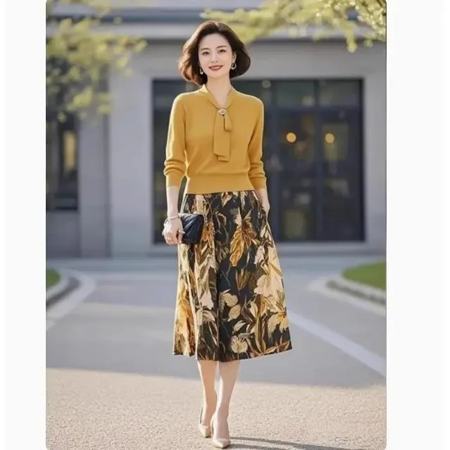 黄色针织套装2025年女装秋季新款高级感系带上衣印花半身裙两件套