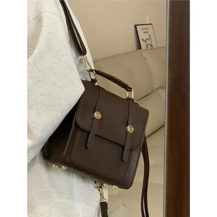 小众美式复古搭扣双肩包斜挎牛津包英伦通勤学生三种背法书包女