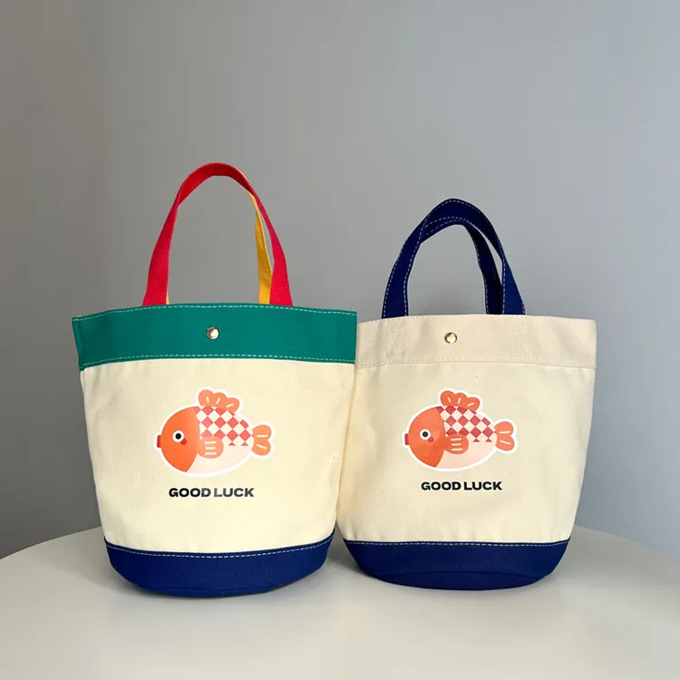 妈咪布包帆布包卡通新款手提包字母包溜娃袋便当水桶母婴包