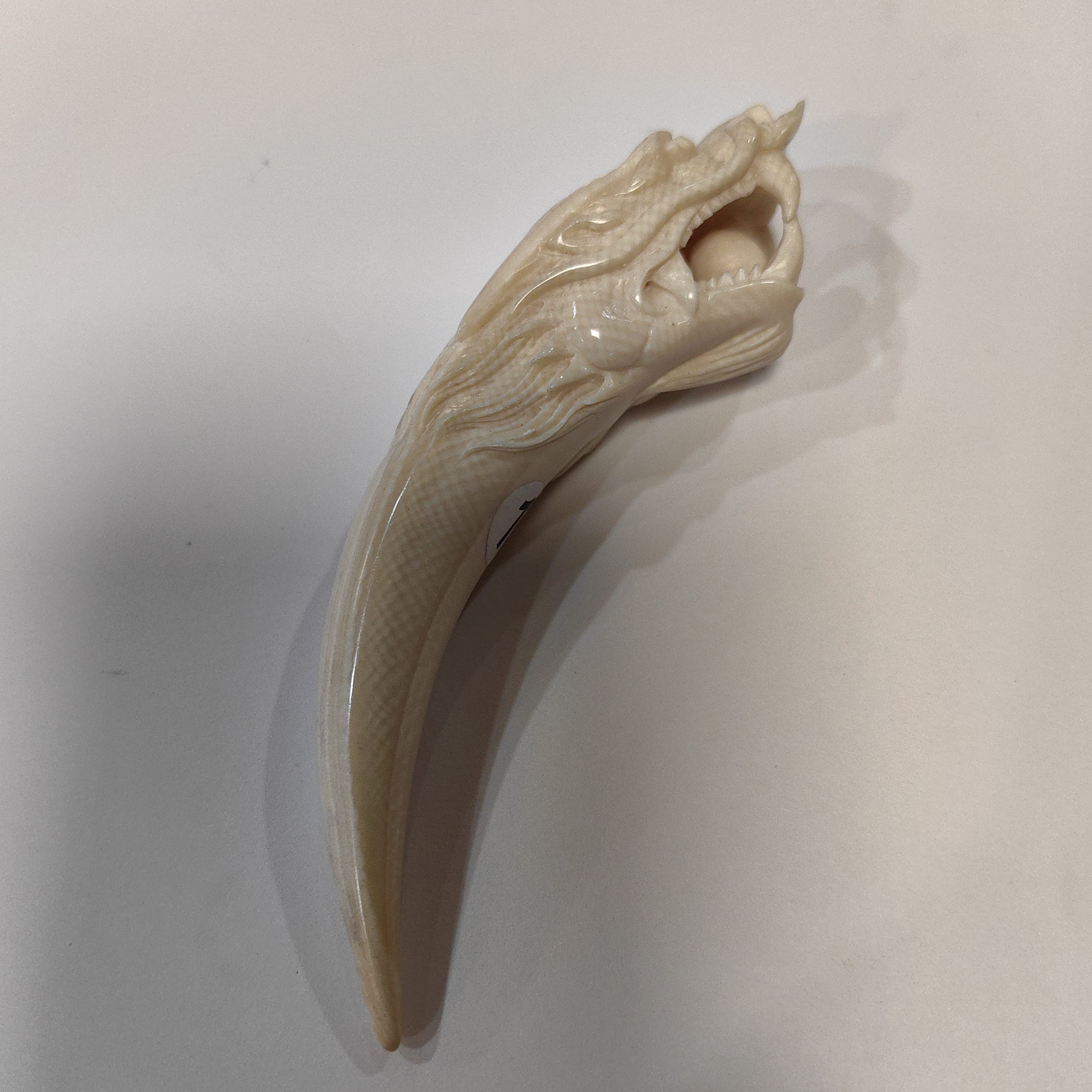 橄榄核雕刻龙牙尖约33克K33