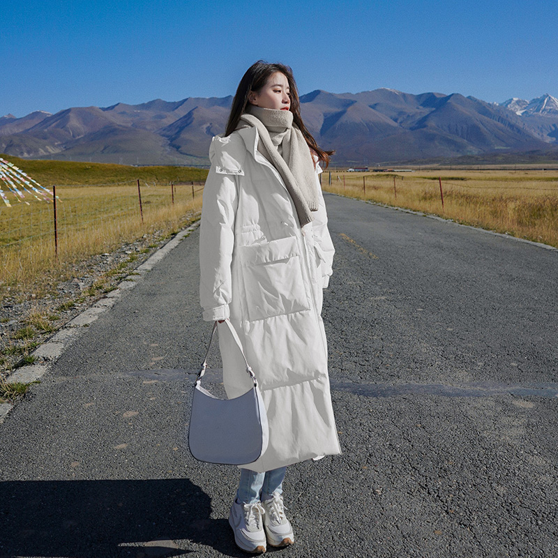 白色长款羽绒服女冬2025新款韩版宽松高级感白鸭绒过膝爆款外套