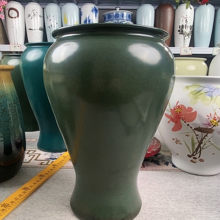 高27内口径14，底部有孔，手工拉胚，茶沫色花盆