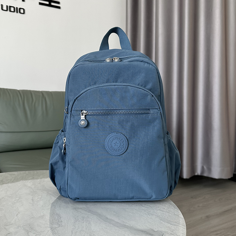 2025新款双肩包女中号百搭背包男轻便书包休闲后背包防泼水布包包