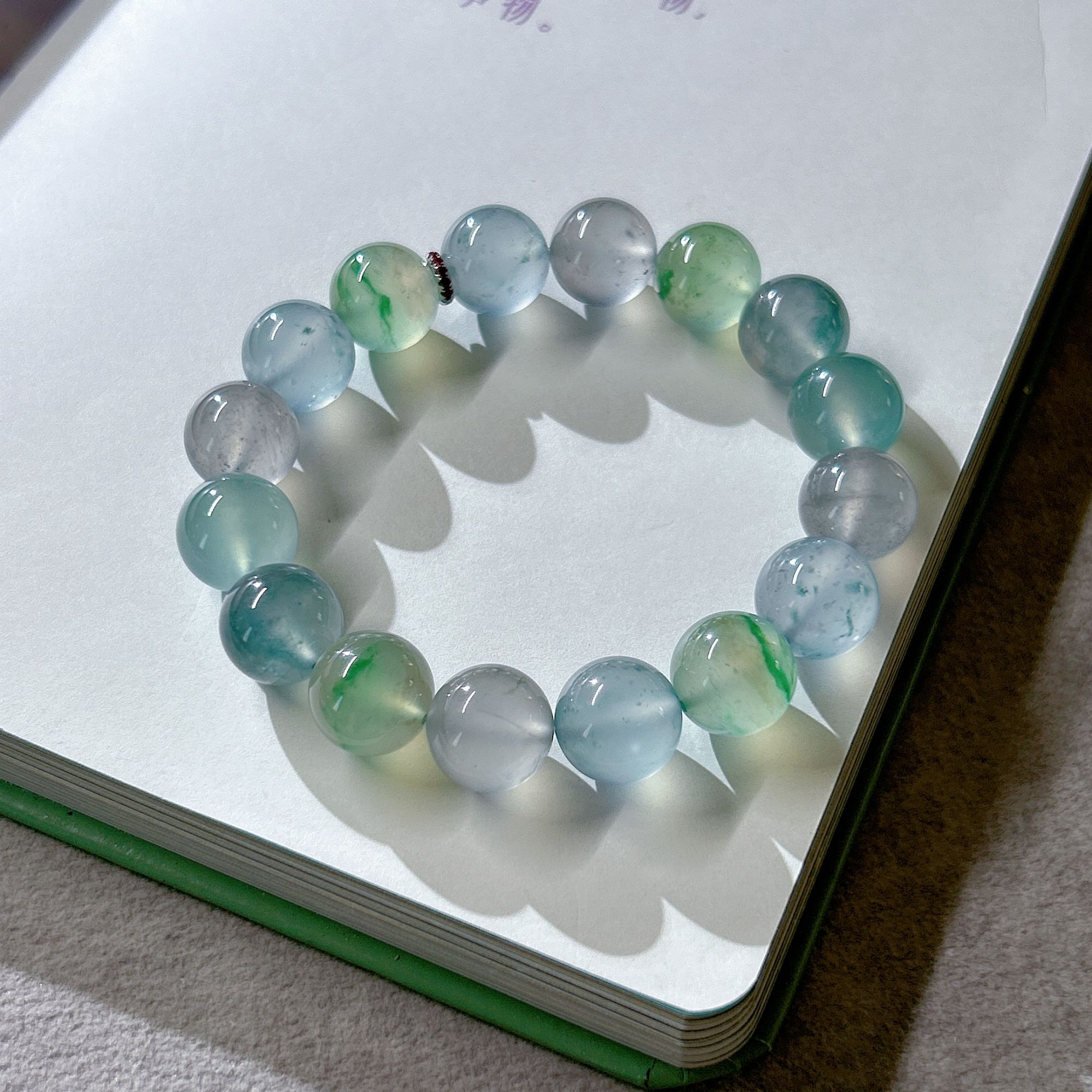 冰种卡12MM飘花多宝手串