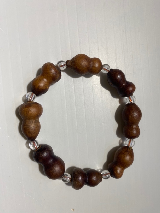 葫芦手串。画皮草里金葫芦手串。