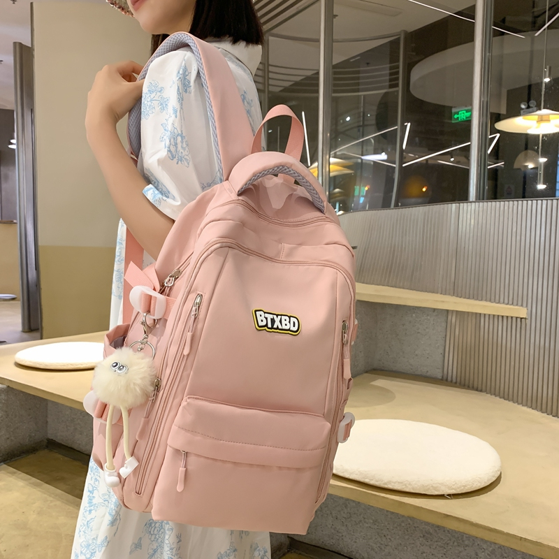 初中生书包女韩版简约百搭小学生轻便减负背包休闲纯色男款双肩包