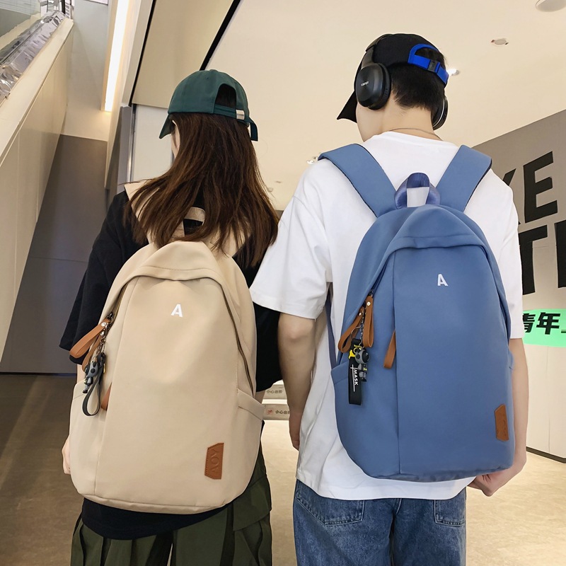日系原宿风电脑双肩包街头潮流情侣休闲背包大容量纯色中学生书包