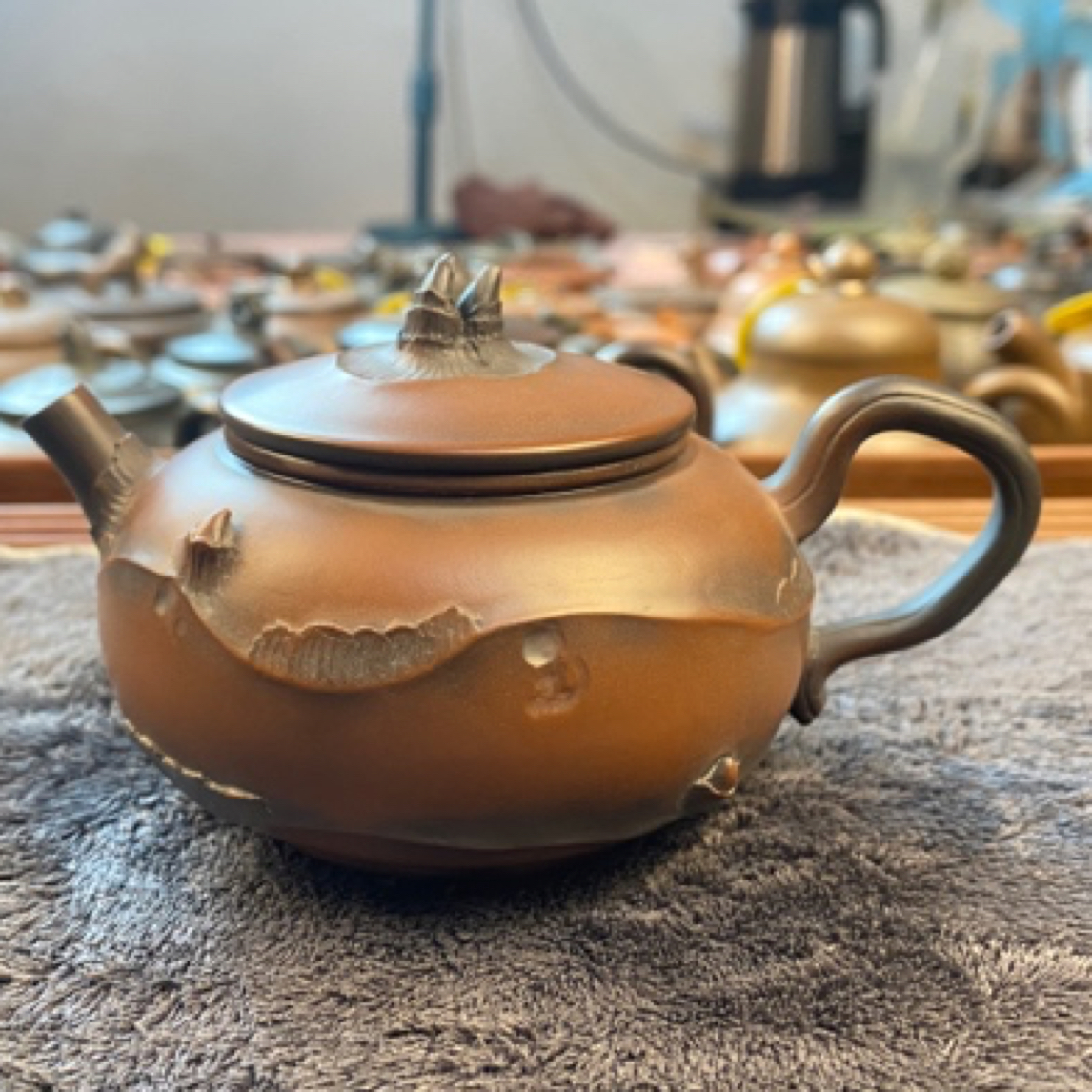 高性价比马蹄壶紫坭薄胎纯手工制150cc钦州坭兴陶内推式球孔出水