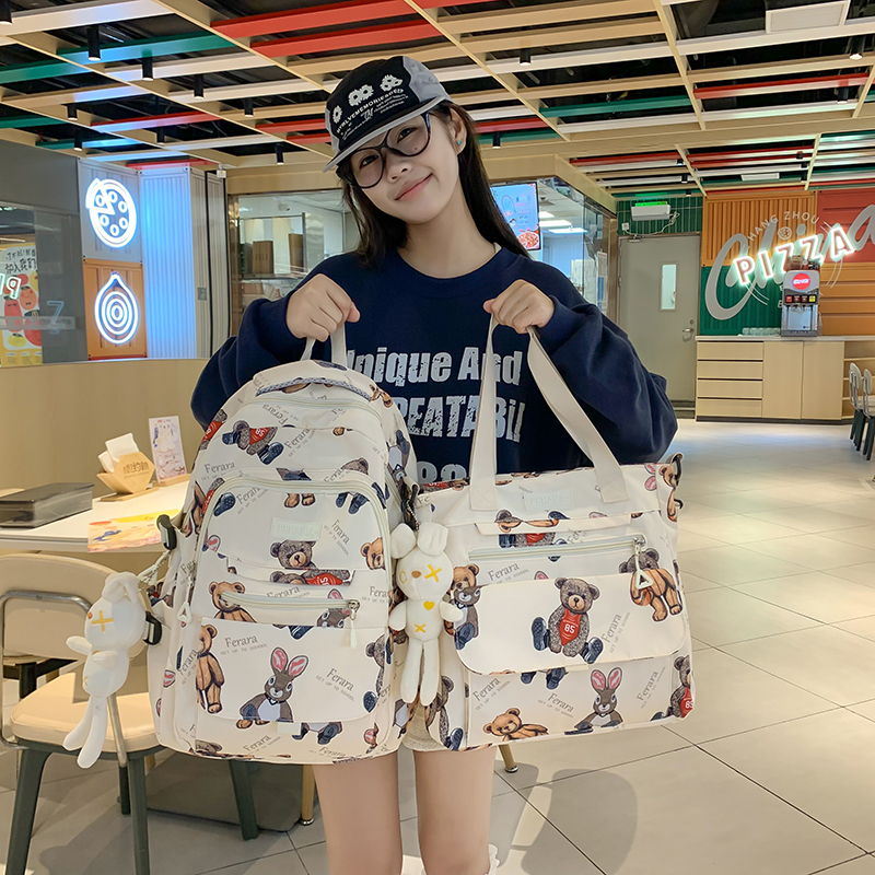 儿童书包2024新款3-6年级小熊印花双肩包女初中生大容量百搭背包