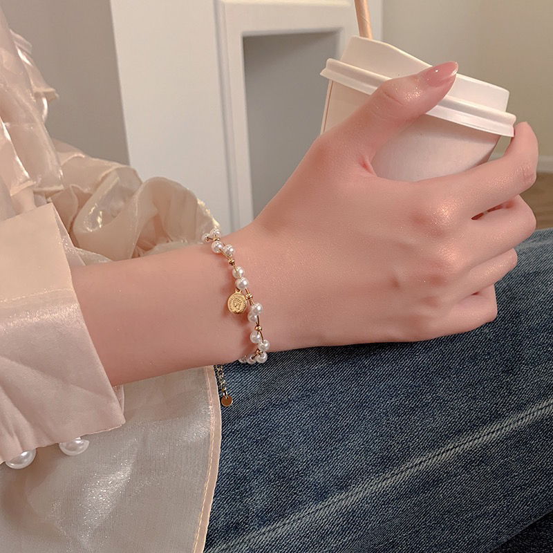 1124轻奢珠珠美人头缠绕时尚个性贝珠手链