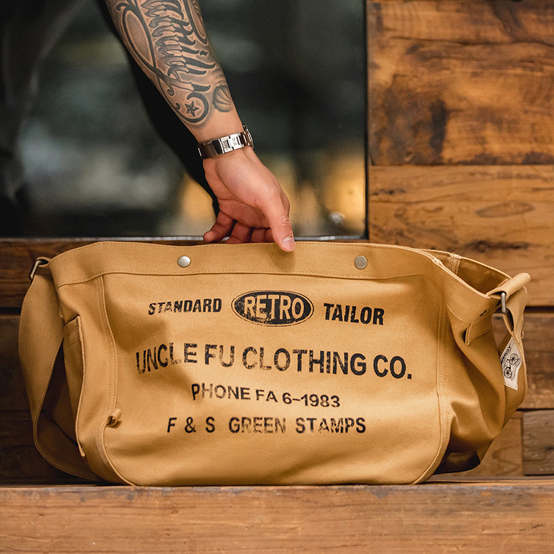 马登工装美式复古大容量斜挎报童包休闲单肩字母帆布托特邮差包男