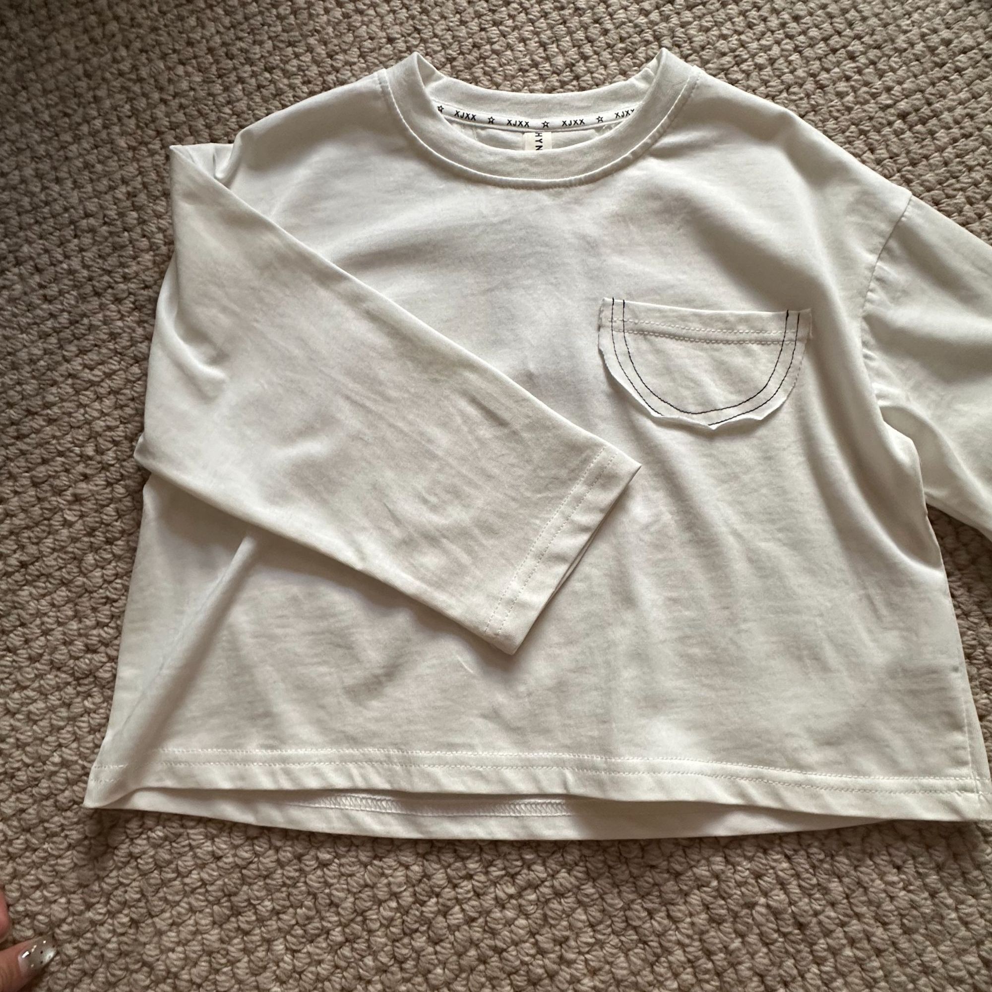 2025翘翘韩货白色女童长袖t恤宝宝休闲时尚圆领套头儿童童装上衣