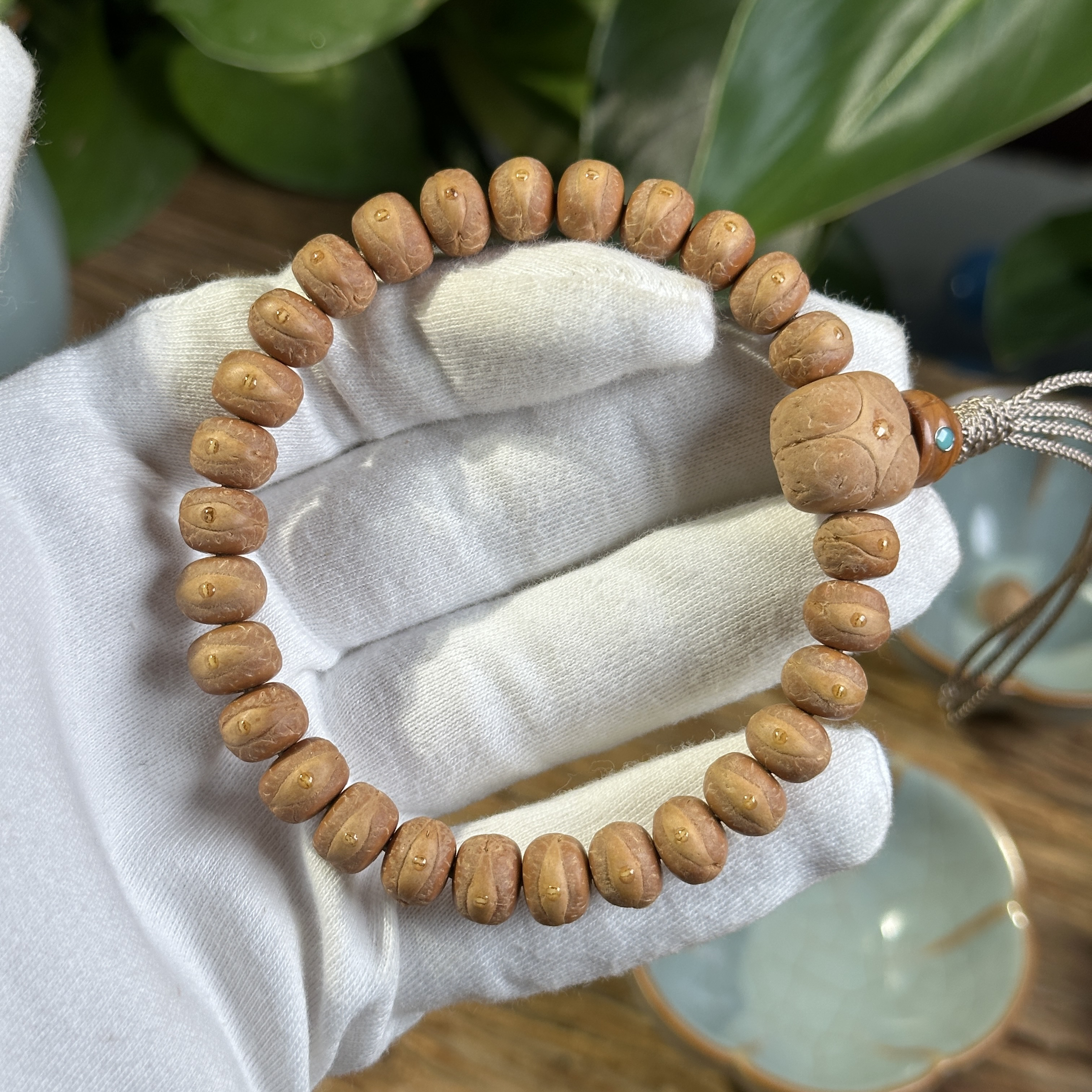 精工藏式9.5毫米尼泊尔小凤眼菩提手串红皮金眼