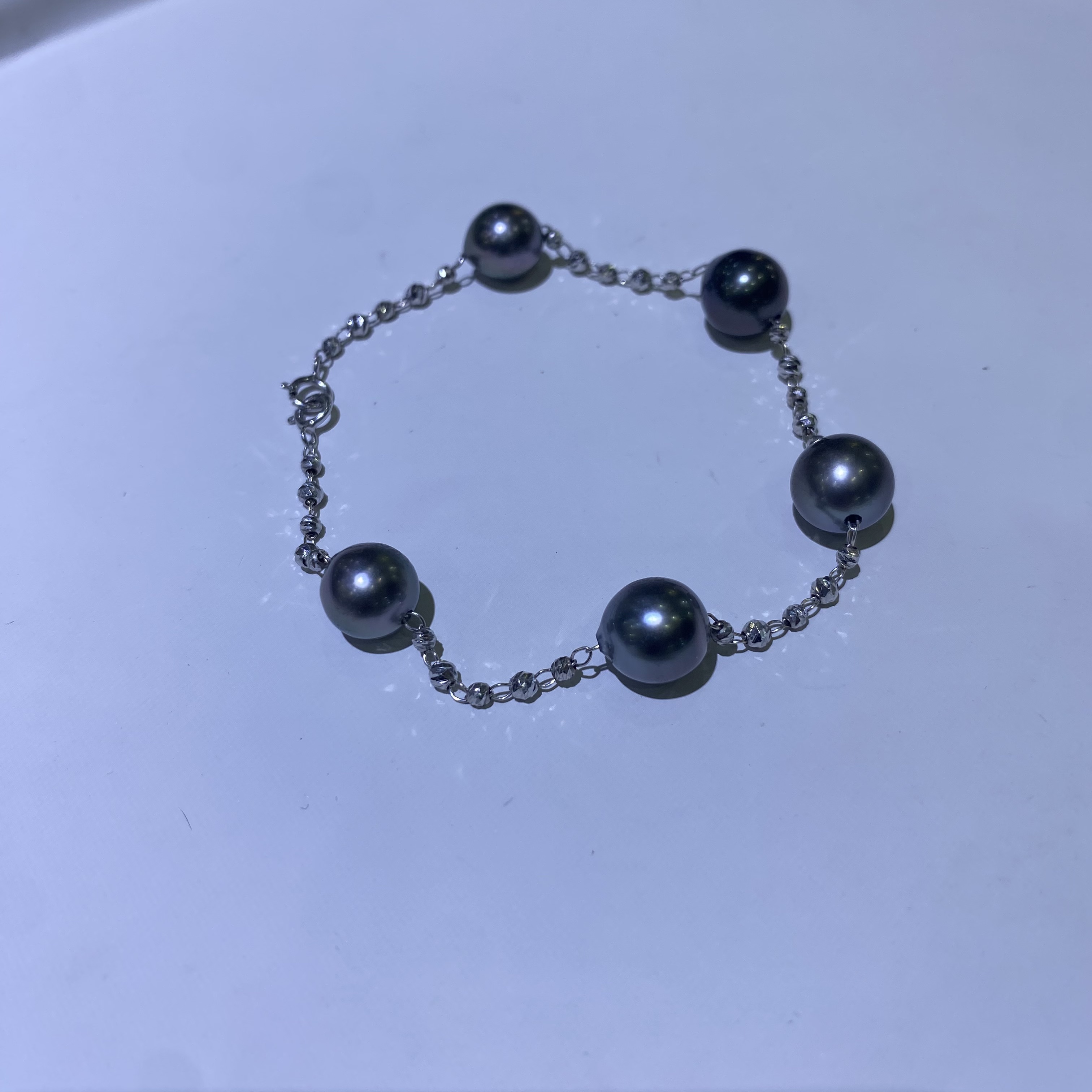 18k金特选高品质大溪地极强光正圆极微瑕手链8-9mm