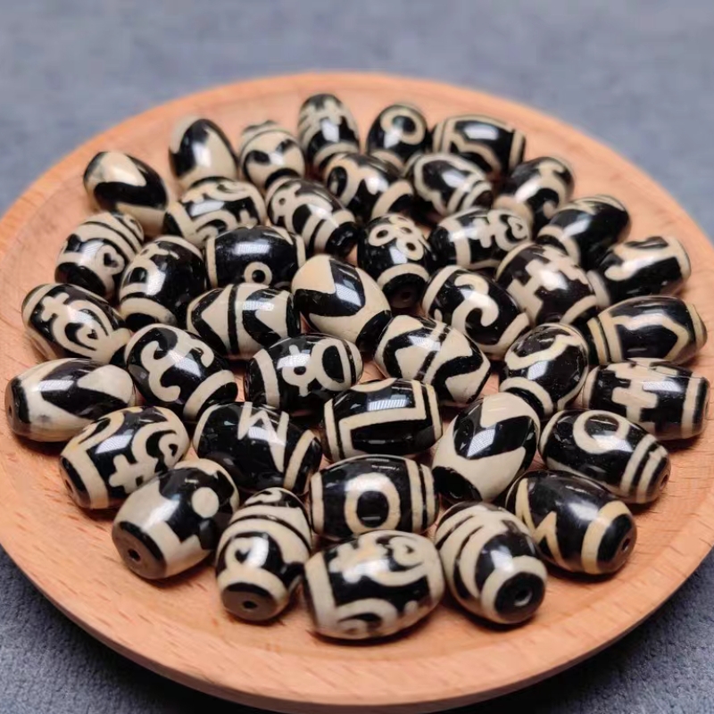 藏传高油高亮黑金牙黄小鼓珠14*10㎜（此链接为2粒价格）。