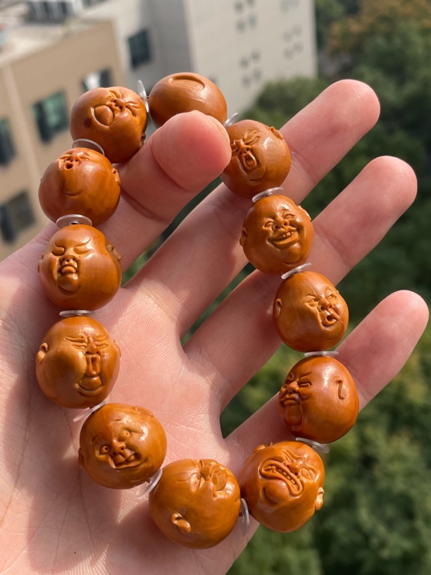 橄榄核核雕尺寸2.0开心百态手工文玩手串手持精品核雕核质红润