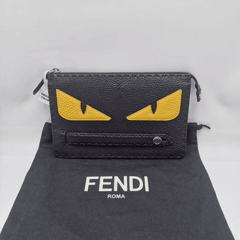 99新 FENDI/芬迪 98新16215 芬迪 黄眼睛黑色全皮手拿包 男士时尚