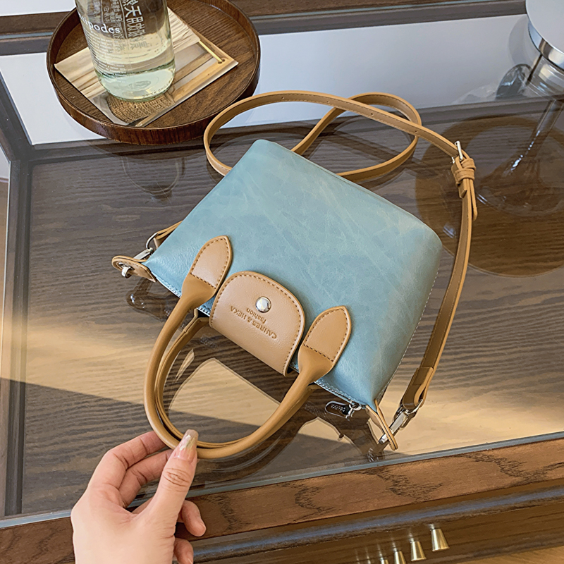 手拎撞色水桶包女2024夏季新款简约百搭单肩包小众潮流休闲斜挎包