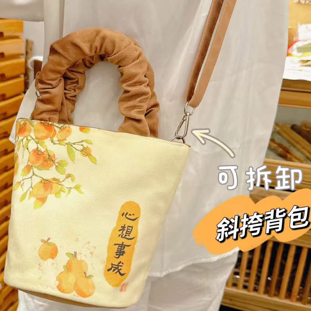 【做个富婆*心想柿成】新款原创斜挎水桶包小众设计感手提包1052