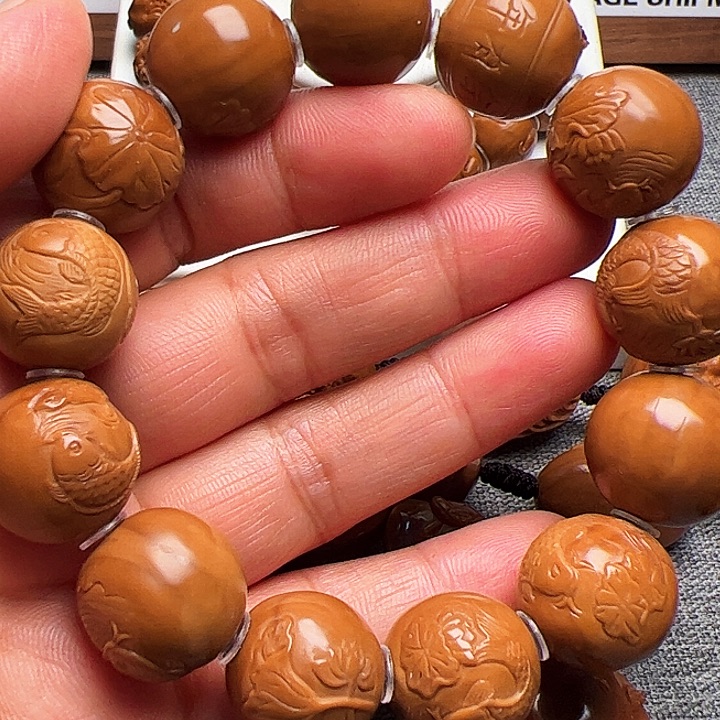 辉***呀橄榄核手串/手链莲花鱼