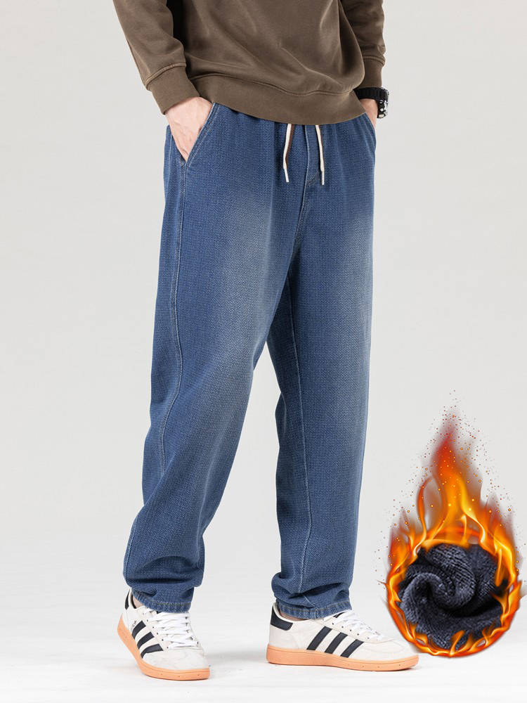 男生秋冬厚款九分牛仔裤提花松紧腰微锥牛仔裤抽绳哈伦大码牛仔裤