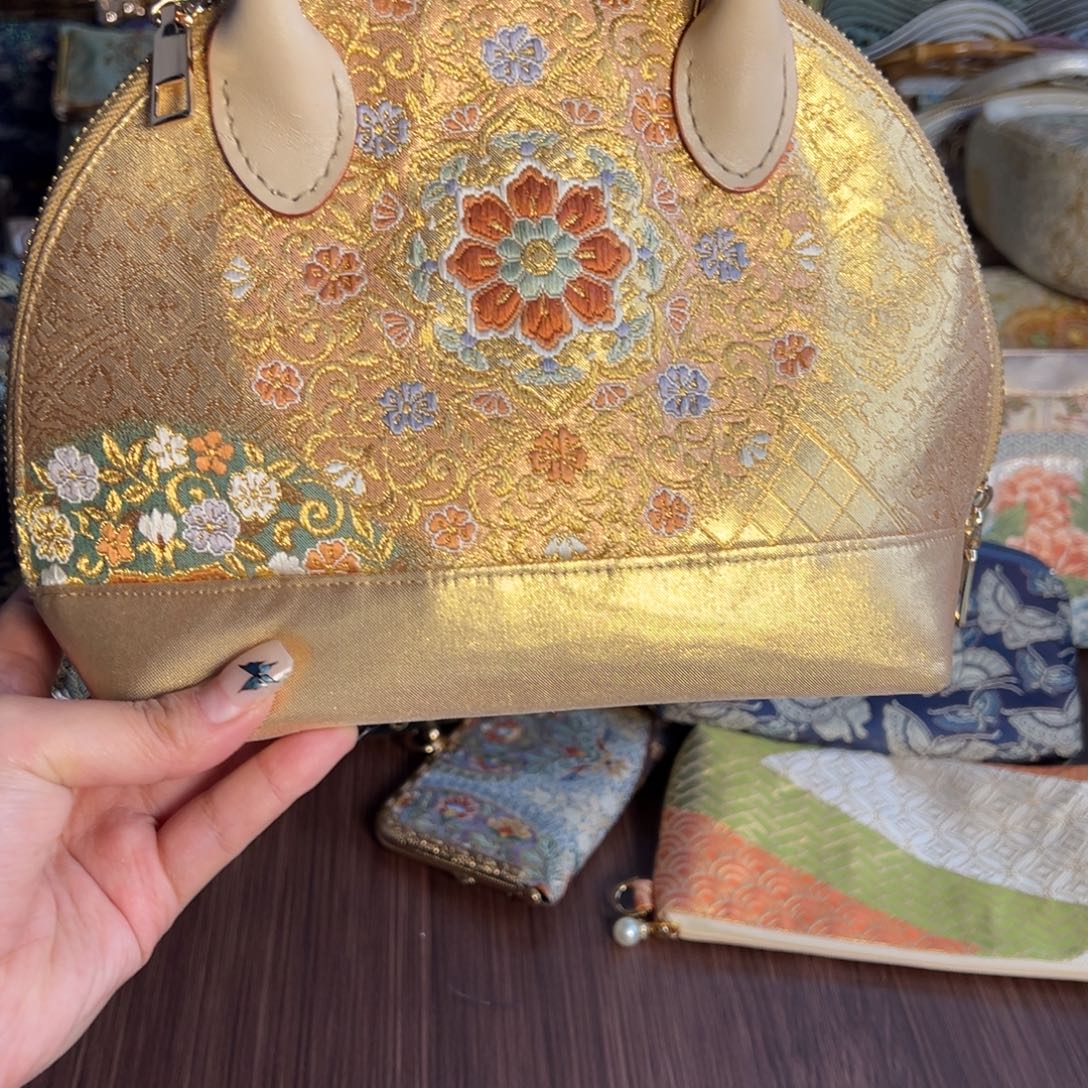 晨***水织绣贝壳包不退换