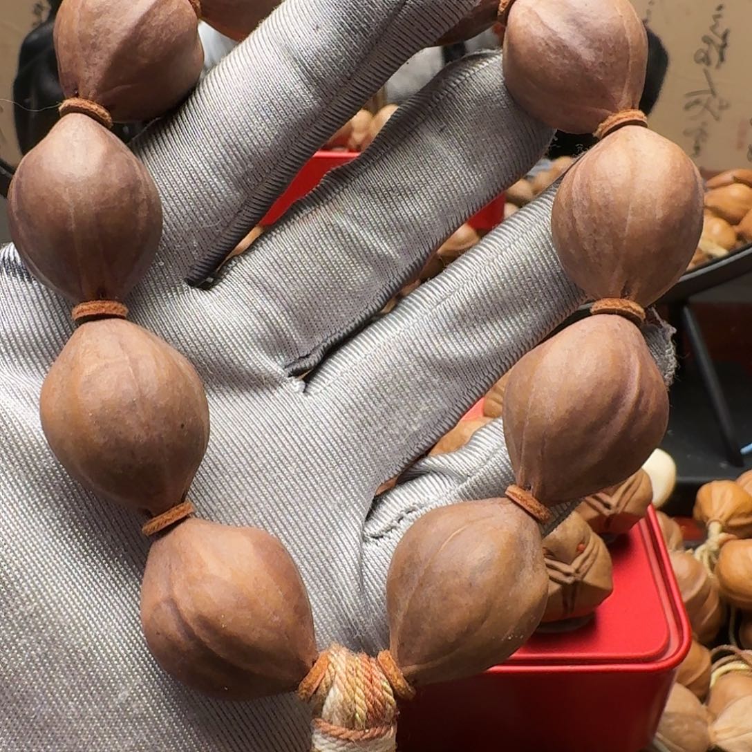 内***哈橄榄核手串紫皮核