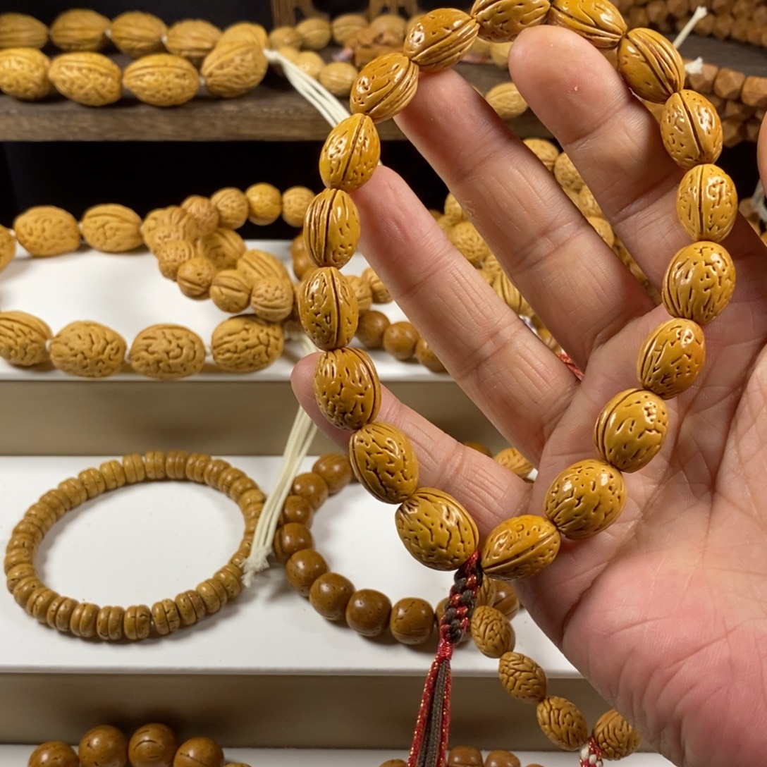 郑***好吊坠桃核钱袋子原皮手持奶油核