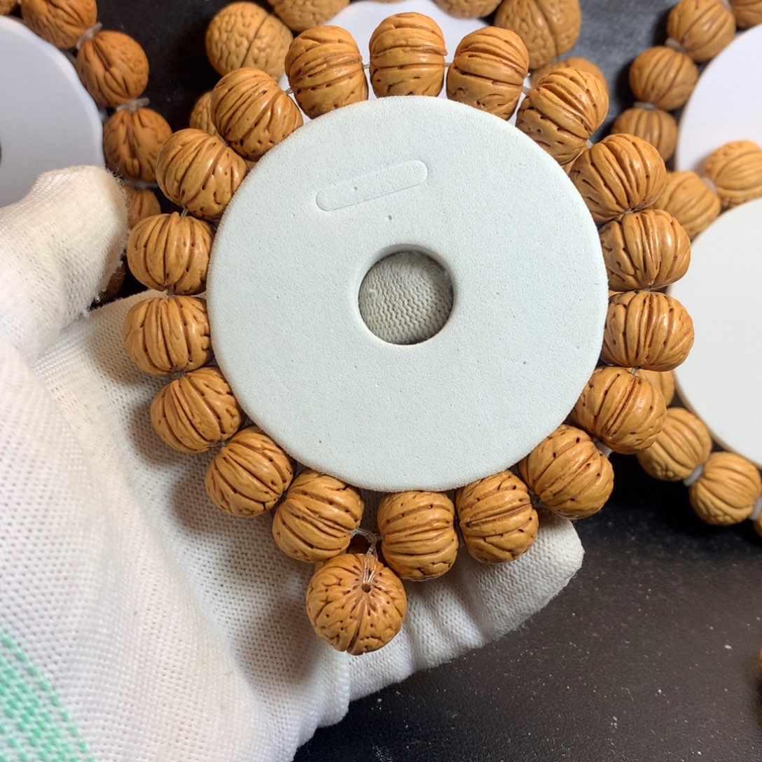 ****定桃核手串17树王纽扣